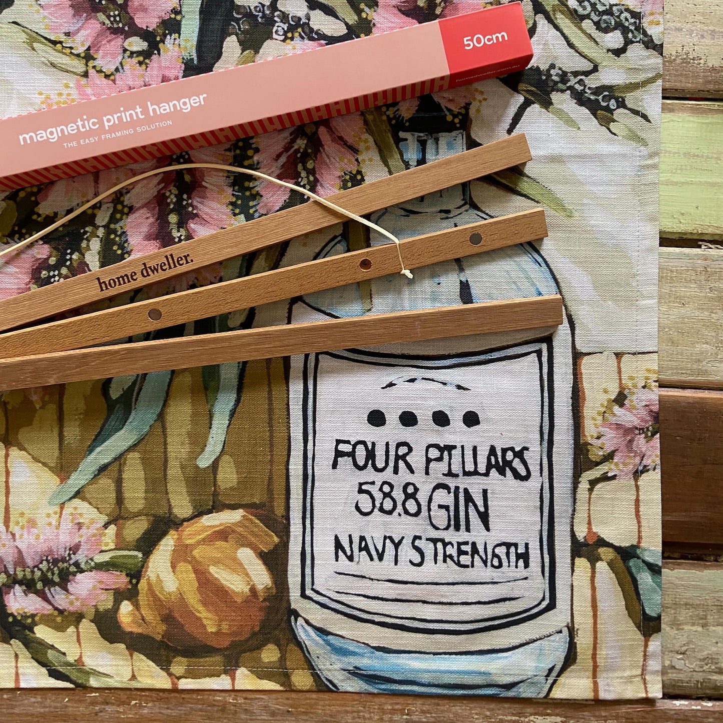 50cm magnetic print hanger displaying tea towel
