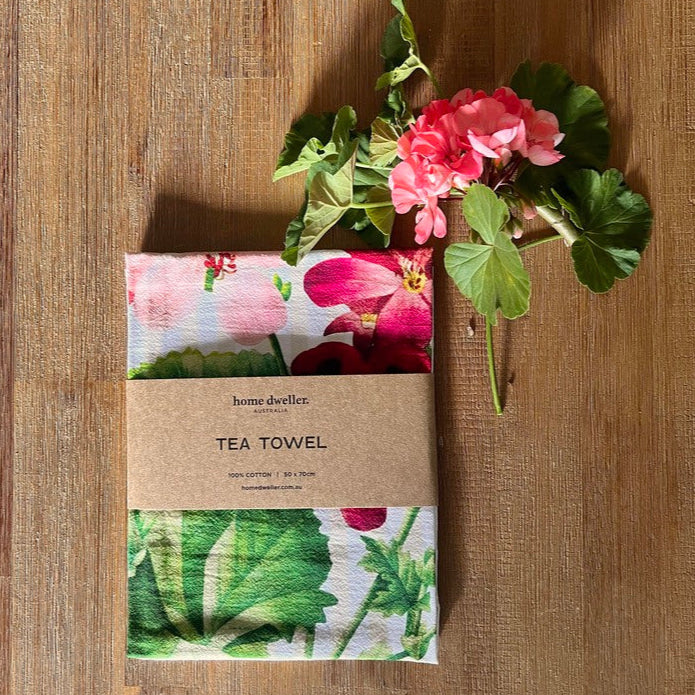 Home Dweller botanical tea towel styled in kitchen with flowers