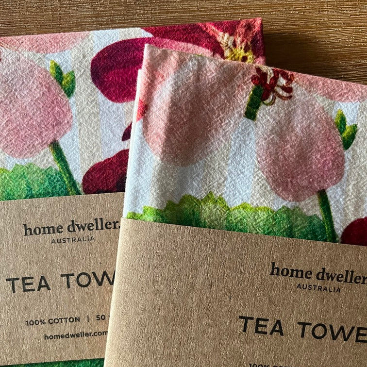Close-up of textured cotton tea towel with botanical artwork