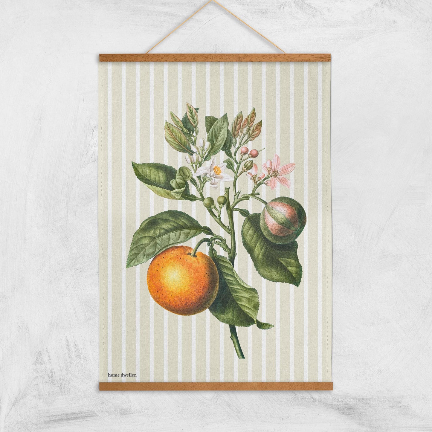 Cotton art tea towel with vintage botanical design hanging with magnetic print hanger