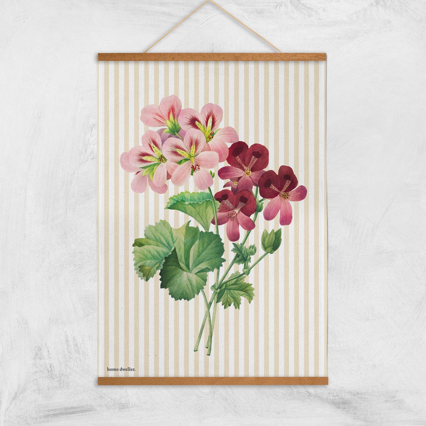 Cotton art tea towel with vintage botanical design hanging with magnetic print hanger