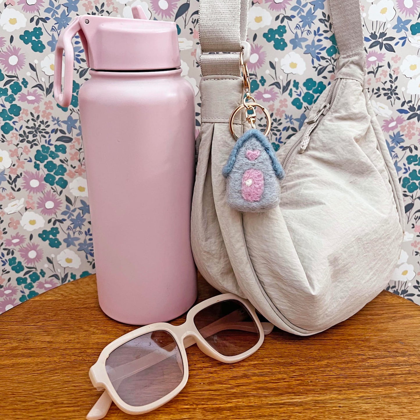 Decorative wool house charm used as bag accessory