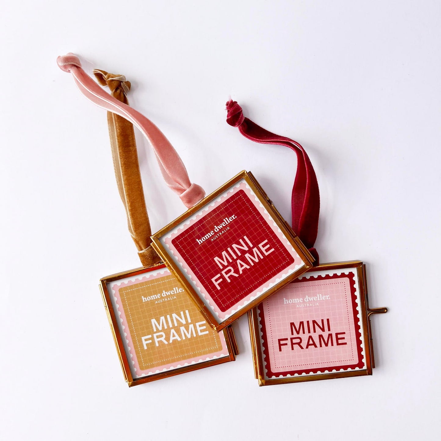 Square glass keepsake frame with brass trim