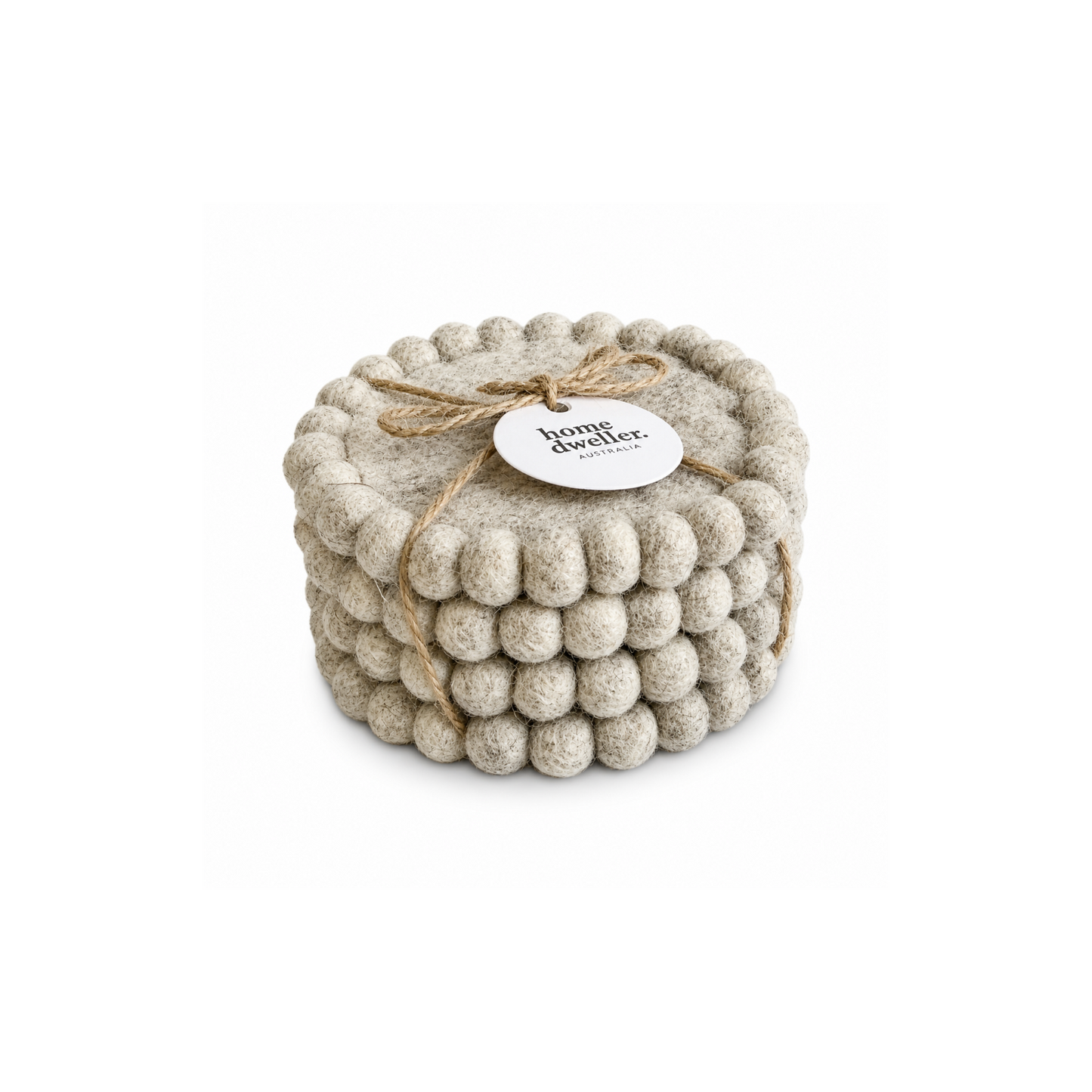 Textured wood coaster with a tag labeled 'home dweller' on a white background