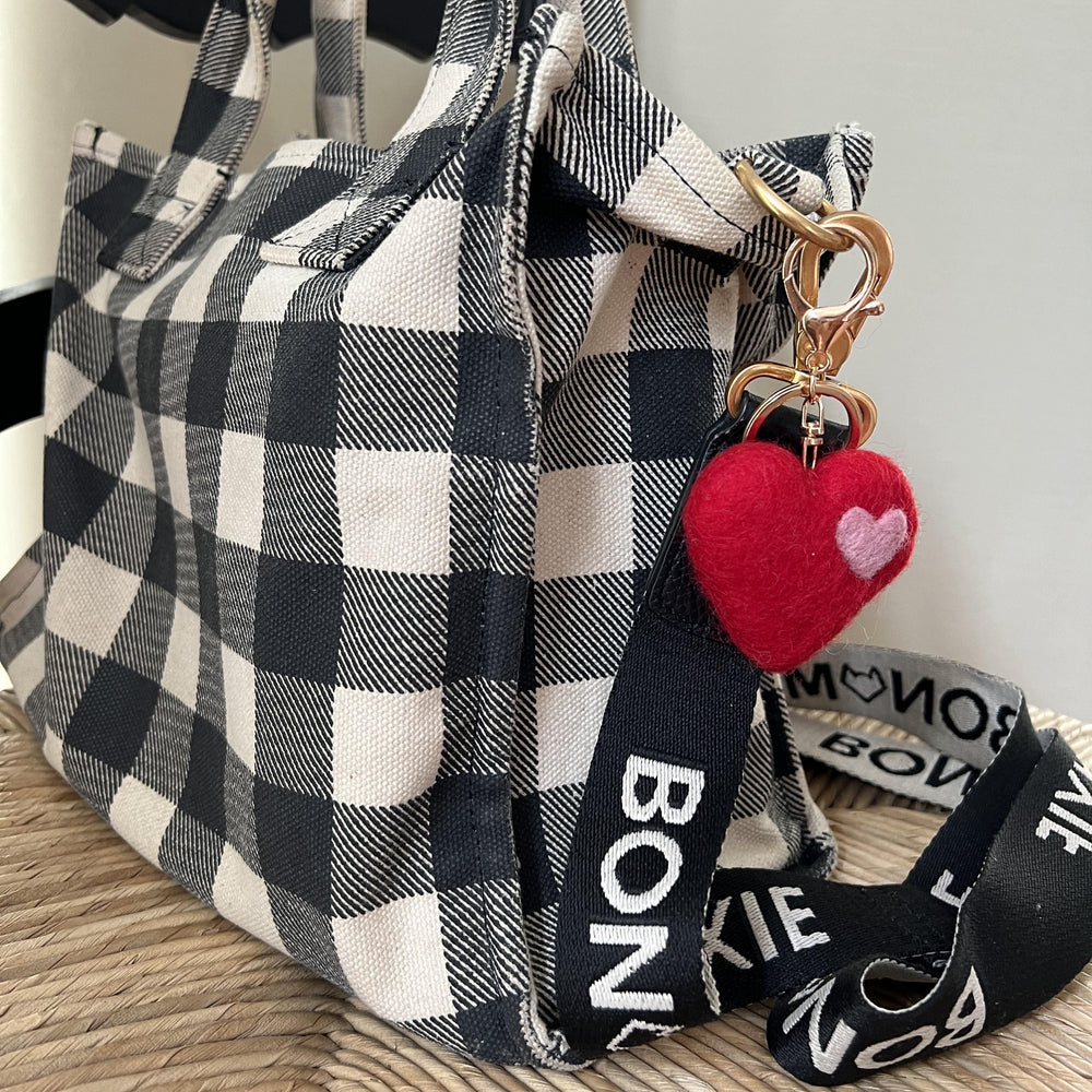 
                  
                    Handmade wool heart charm as bag accessory
                  
                