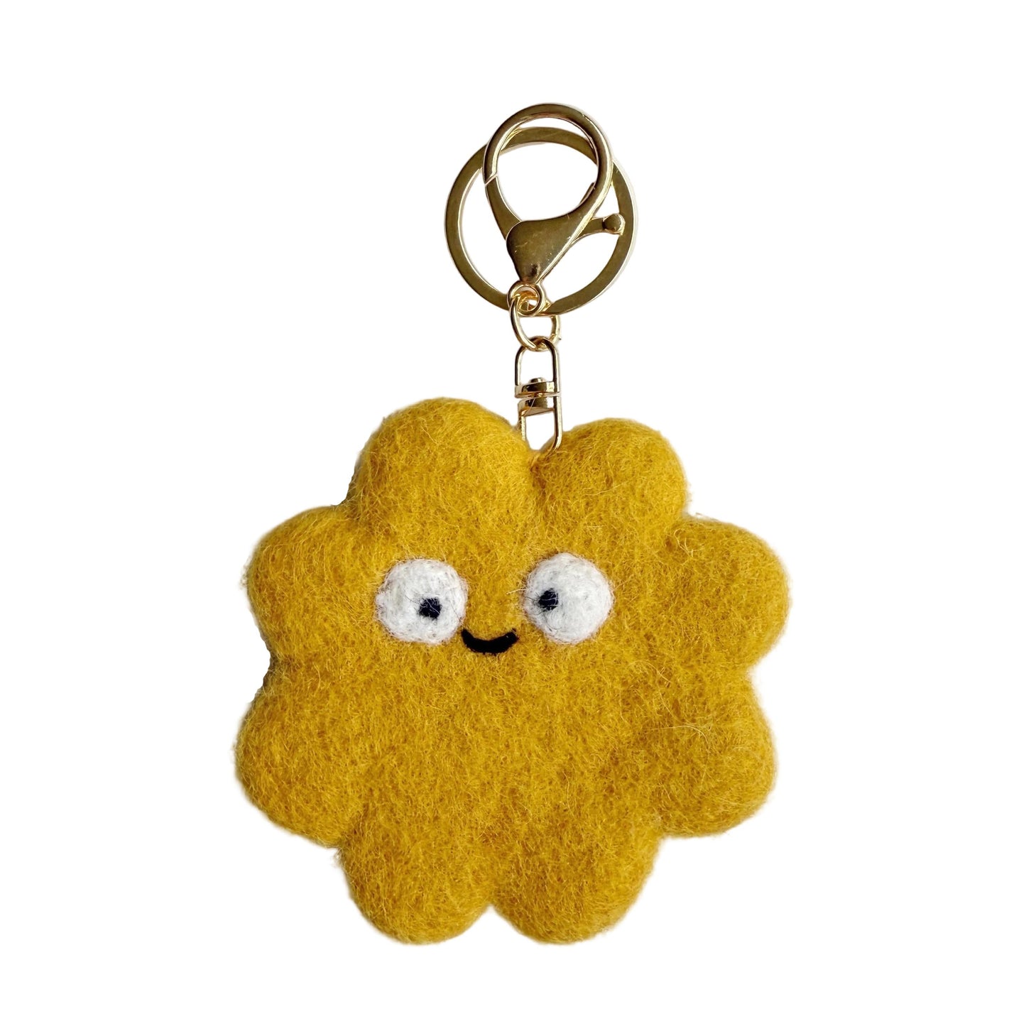 Yellow cloud-shaped keychain with a smiling face on a white background