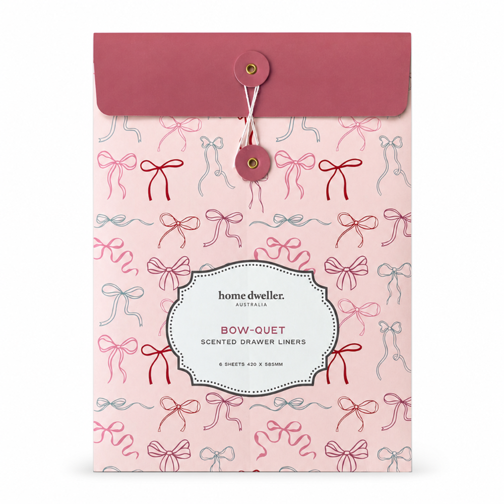 Home Dweller Australia 'Bow-Ouet' scented drawer liners in a pink envelope-style box with a repeating bow pattern and a dusty rose flap.